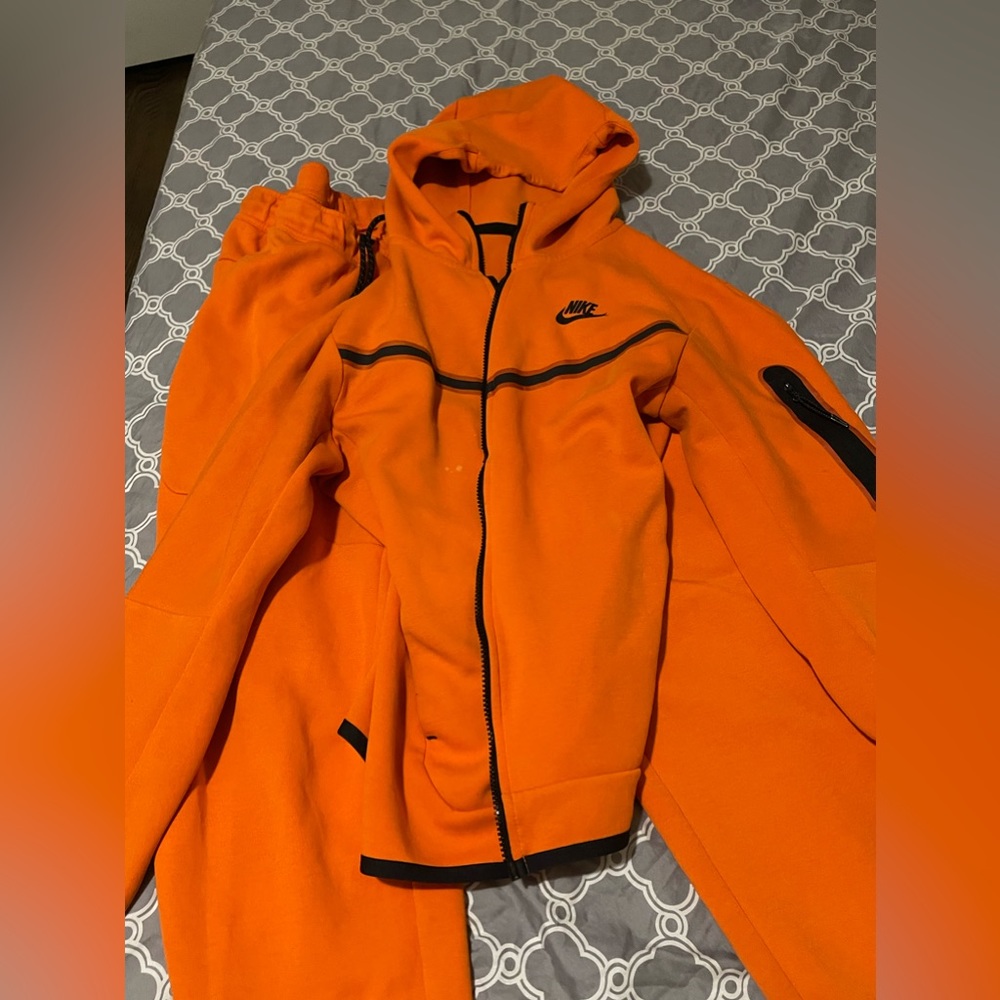 Orange Nike Tech Suit.